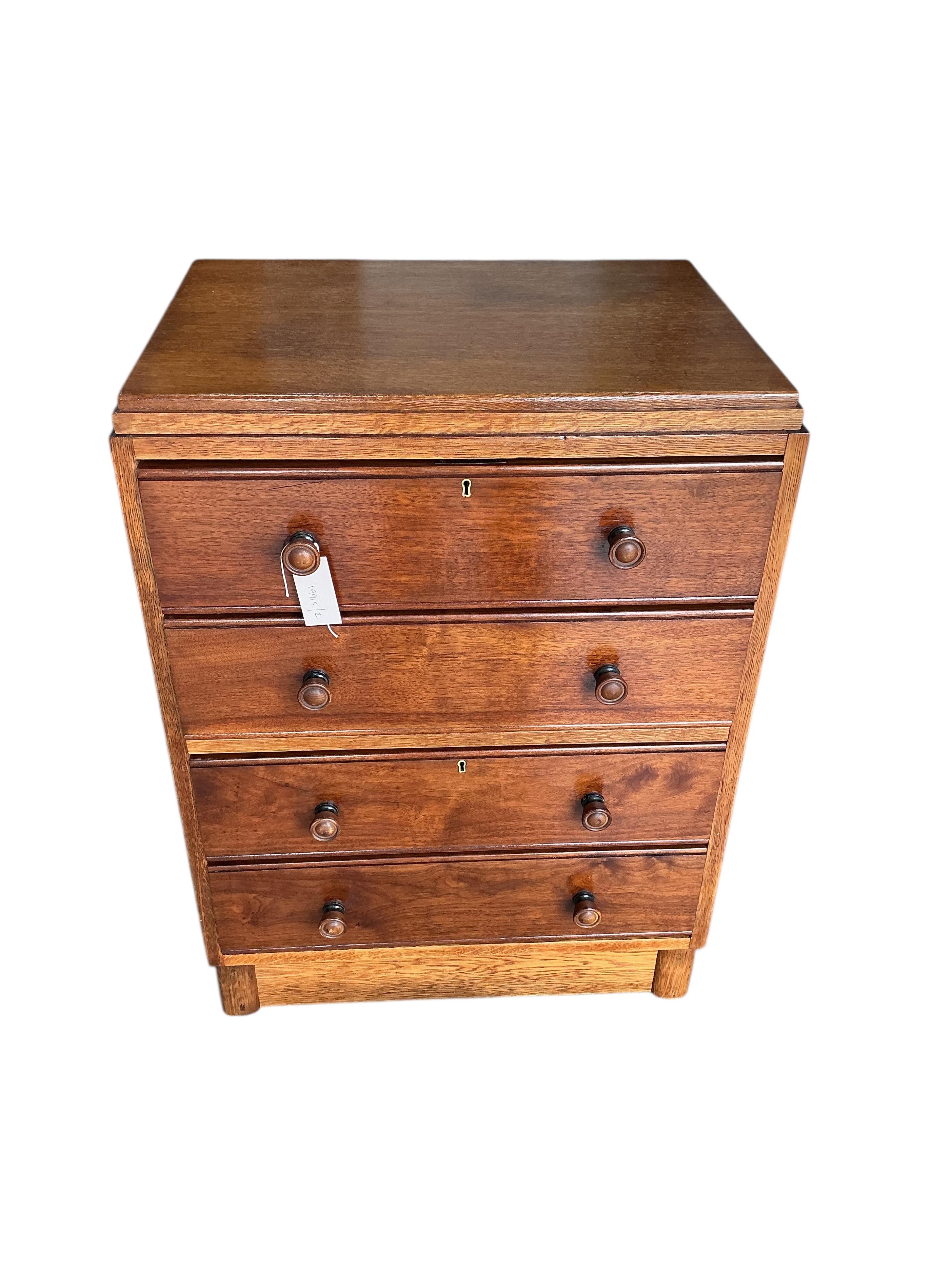A small early 20th century oak chest of four drawers, width 61cm, depth 44cm, height 83cm